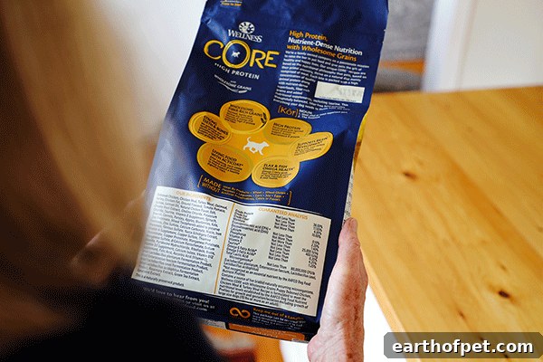 Woman holding Wellness Core Puppy dog food, is fish oil good for dogs